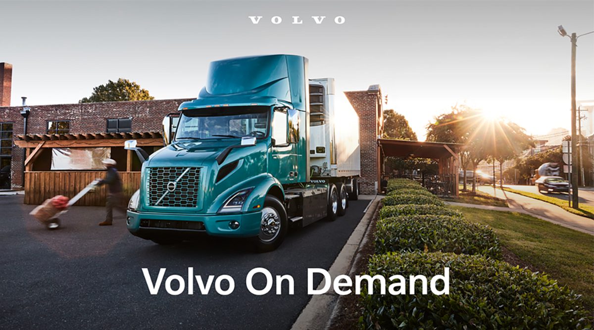Image of Volvo's VNR Electric Truck parked in front of a warehouse.